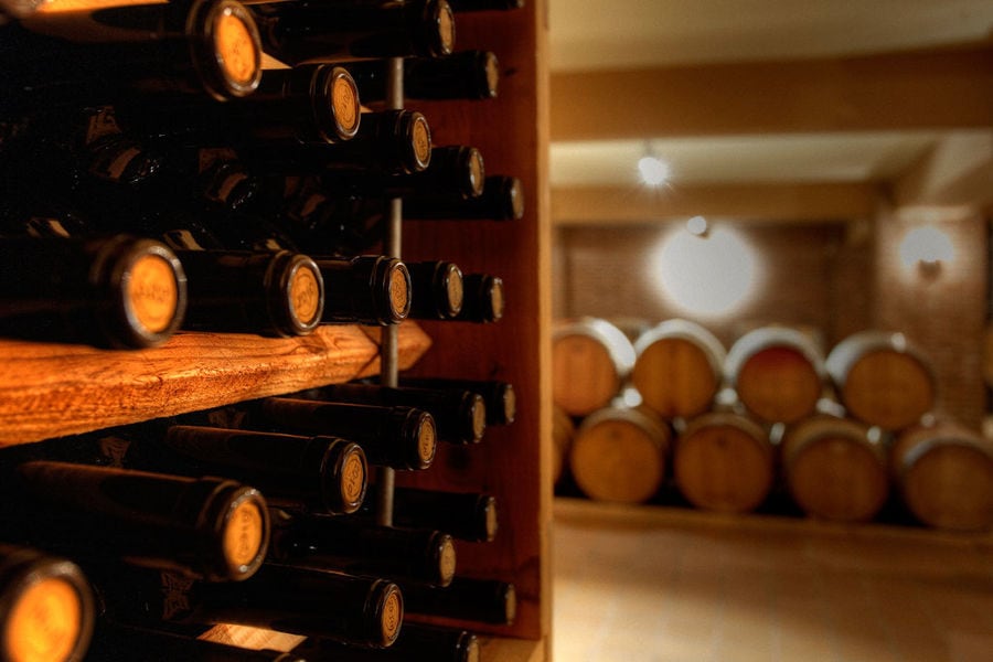 wine bottles on top of each other in the storage locker at 'Domaine Skouras' cellar